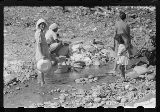 Untitled photo, possibly related to: Washing clothes in the river near the slum area known as "El Machuelitto" in Ponce, Puerto Rico