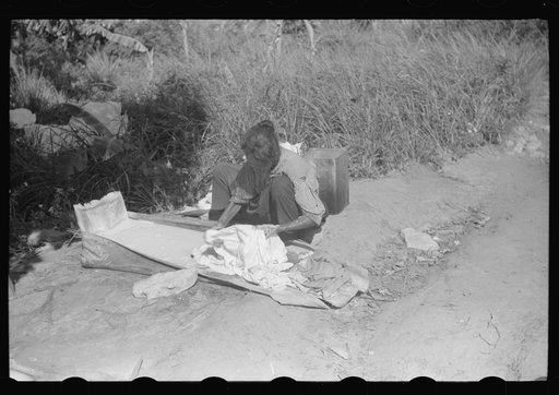 Untitled photo, possibly related to: Using palm leaf as a wash tub on a farm near Manati, Puerto Rico