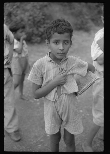 Untitled photo, possibly related to: Children coming home from school on a road near Manati, Puerto Rico
