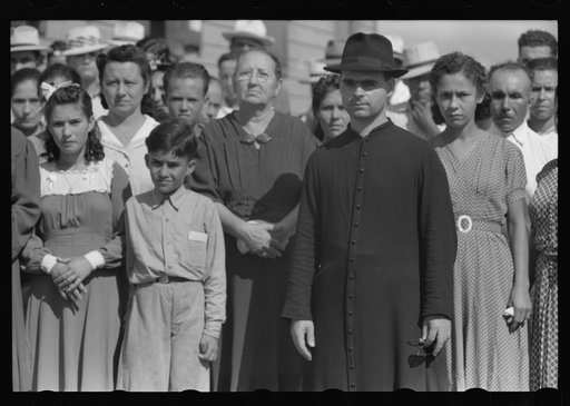 Untitled photo, possibly related to: Priest baptizing children at the celebration for tenant purchase FSA (Farm Security Administration) borrowers on a farm near Corozal, Puerto Rico