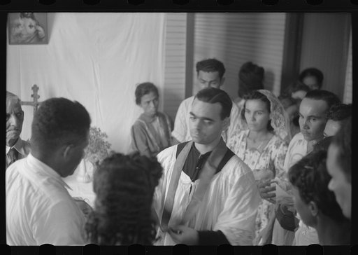 Untitled photo, possibly related to: Priest conductiong religious service at the celebration for tenant purchase, FSA (Farm Security Administration) borrowers on a farm near Corozal, Puerto Rico