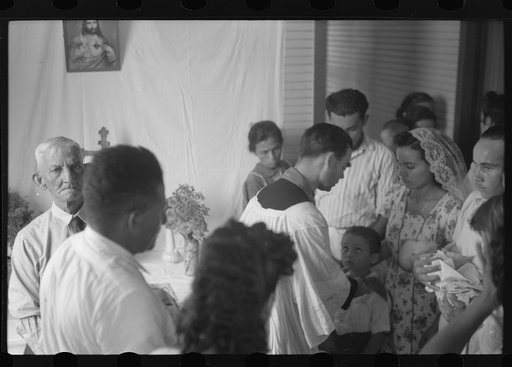Priest conductiong religious service at the celebration for tenant purchase, FSA (Farm Security Administration) borrowers on a farm near Corozal, Puerto Rico