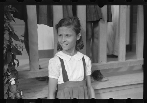Little girl who attended the celebration for tenant purchase FSA (Farm Security Administration) borrowers on a farm near Corozal, Puerto Rico
