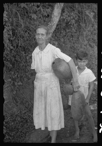 Untitled photo, possibly related to: Waiting at a spring to get water which is carried in gourdlike containers. Near Corozal, Puerto Rico