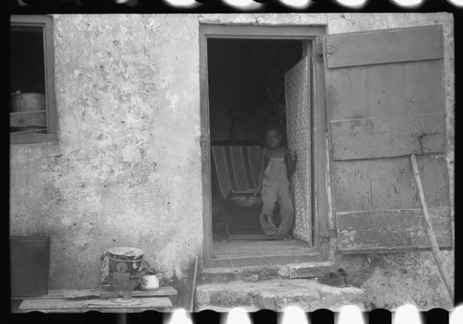 Untitled photo, possibly related to: Old slave quarters still being used in one of the slum "villages," St. Croix, Virgin Islands