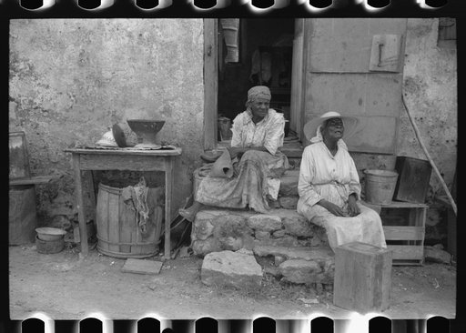 Old Negro women living in one of the slum "villages" that used to be slave quarters. Near Christiansted, St. Croix, Virgin Islands
