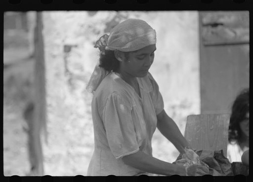 Puerto Rican woman washing clothes in one of the slum "villages" near Fredericksted, St. Croix, Virgin Islands