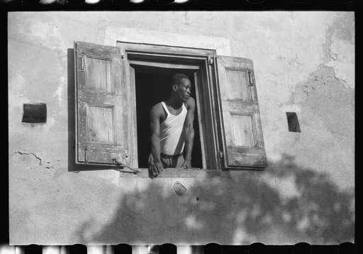 Worker who lives on one of the steep streets in Charlotte Amalie, St. Thomas, Virgin Islands