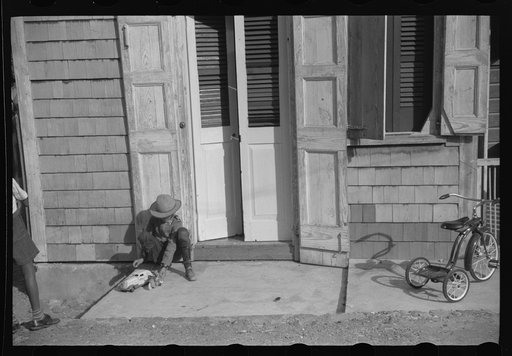 Untitled photo, possibly related to: Children playing with their Christmas toys on a side street, Charlotte Amalie, St. Thomas, Virgin Islands