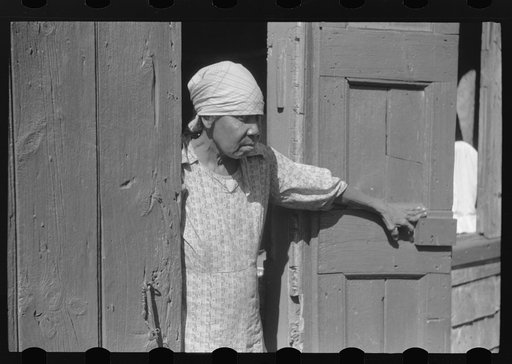 Untitled photo, possibly related to: Charlotte Amalie, St. Thomas Island, Virgin Islands. Woman living in one of the bandbox houses