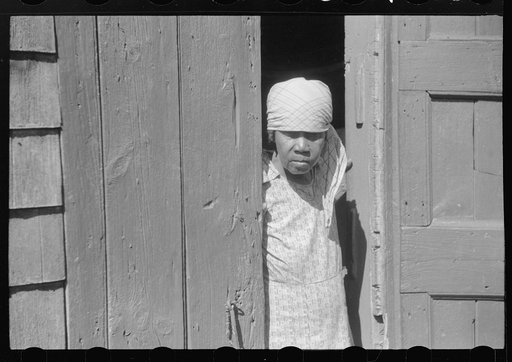 Untitled photo, possibly related to: Charlotte Amalie, St. Thomas Island, Virgin Islands. Woman living in one of the bandbox houses