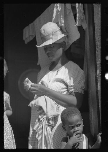 Untitled photo, possibly related to: Charlotte Amalie, St. Thomas Island, Virgin Islands. Family living in a slum area