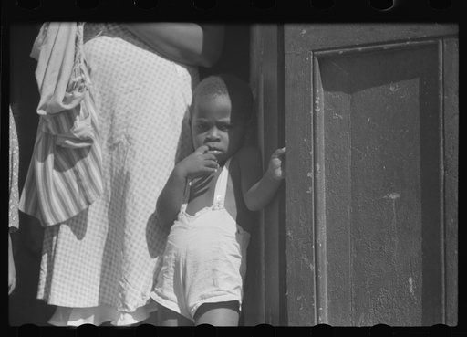 Untitled photo, possibly related to: Charlotte Amalie, St. Thomas Island, Virgin Islands. Family living in a slum area