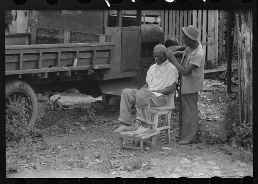 Charlotte Amalie, St. Thomas Island, Virgin Islands. Barber in a slum area