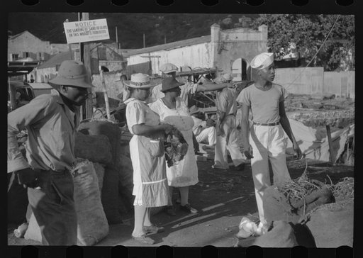 Charlotte Amalie, St. Thomas Island, Virgin Islands. Shoppers on Tortolla wharf