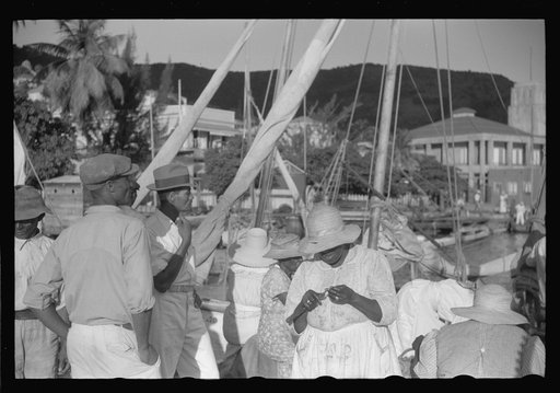Charlotte Amalie, St. Thomas Island, Virgin Islands. Shoppers waiting on Tortolla wharf