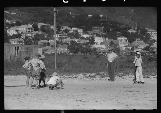 Untitled photo, possibly related to: French Village, a small settlement on St. Thomas Island, Virgin Islands. Children playing marbles on an open lot