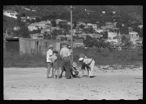 Untitled photo, possibly related to: French Village, a small settlement on St. Thomas Island, Virgin Islands. Children playing marbles on an open lot