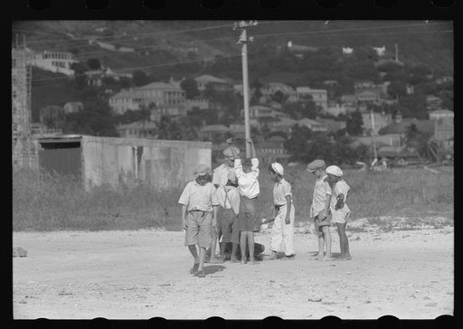 Untitled photo, possibly related to: French Village, a small settlement on St. Thomas Island, Virgin Islands. Children playing marbles on an open lot