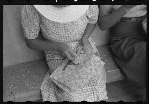 Charlotte Amalie, St. Thomas Island, Virgin Islands. Embroidering a handbag at the handicrafts cooperative