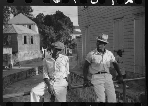 Untitled photo, possibly related to: Charlotte Amalie, St. Thomas Island, Virgin Islands. Lounging on a bridge over an open sewer on a side street
