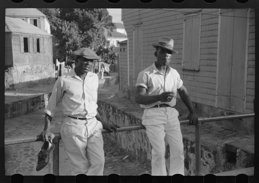Untitled photo, possibly related to: Charlotte Amalie, St. Thomas Island, Virgin Islands. Lounging on a bridge over an open sewer on a side street
