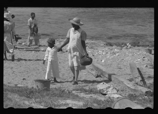 Untitled photo, possibly related to: Buying produce at the waterfront in Christiansted. Most of the food comes in little schooners from Puerto Rico and the neighboring islands. Virgin Islands