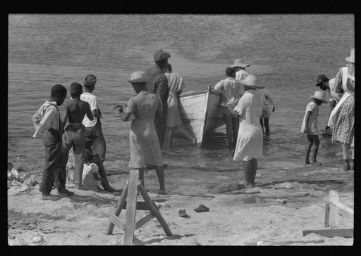Untitled photo, possibly related to: Buying produce at the waterfront in Christiansted. Most of the food comes in little schooners from Puerto Rico and the neighboring islands. Virgin Islands
