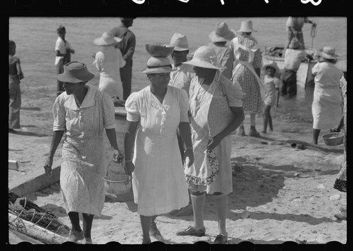 Untitled photo, possibly related to: Buying produce at the waterfront in Christiansted. Most of the food comes in little schooners from Puerto Rico and the neighboring islands. Virgin Islands