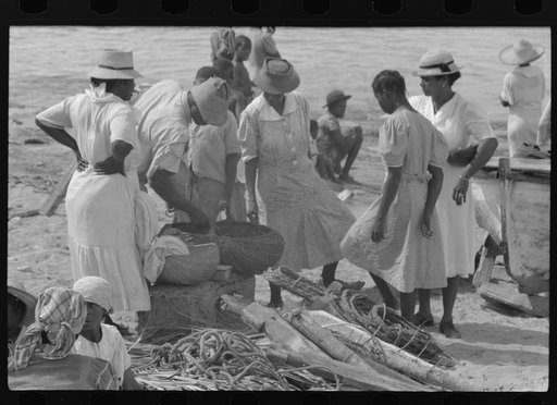 Untitled photo, possibly related to: Buying produce at the waterfront in Christiansted. Most of the food comes in little schooners from Puerto Rico and the neighboring islands. Virgin Islands