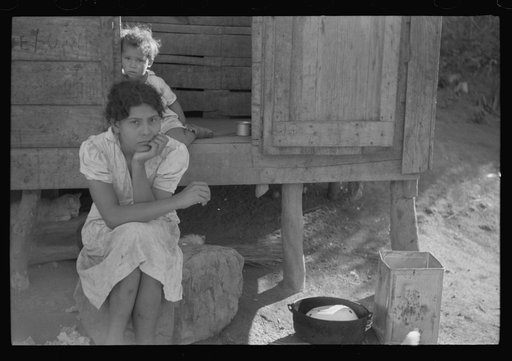 At the home of a farm laborer along the road in the hills near Yauco, Puerto Rico