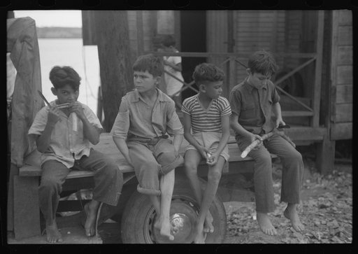 Untitled photo, possibly related to: Boys eating sugarcane in the small fishing village of Puerto Real, Puerto Rico