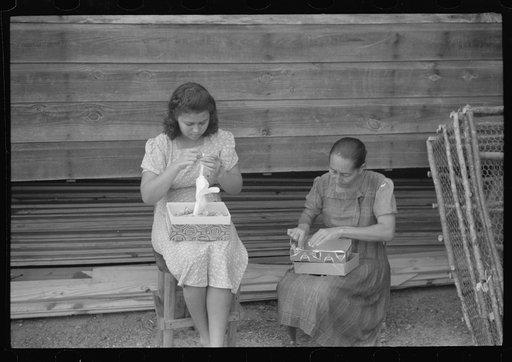 Untitled photo, possibly related to: In the fishing village of Puerto Real, many women take in needlework to do at home to supplement their income from fish. The gloves which these women are stitching are being done for a firm in Mayaguez and will eventually be sold in New York. Puerto Rico