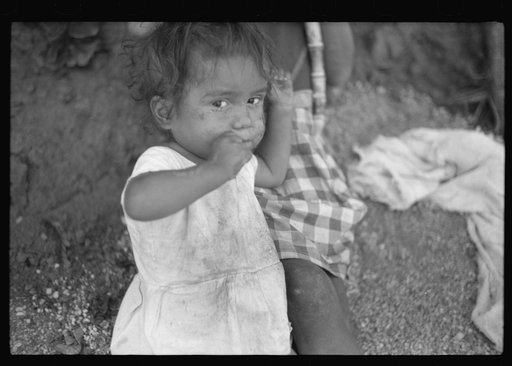 Untitled photo, possibly related to: Farm laborer's children eating sugar cane in the hills near Yauco, Puerto Rico