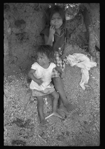 Untitled photo, possibly related to: Farm laborer's children eating sugar cane in the hills near Yauco, Puerto Rico