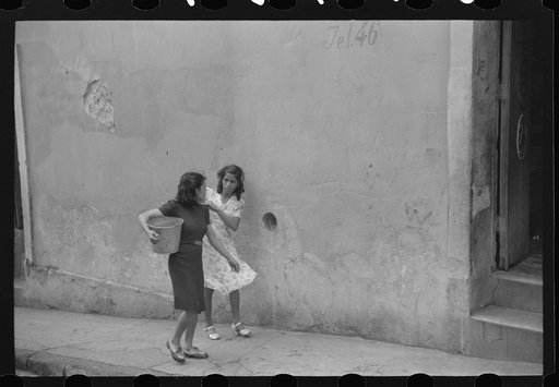 Untitled photo, possibly related to: San Juan, Puerto Rico. People carrying water home because of the failure of the water system in San Juan for three days
