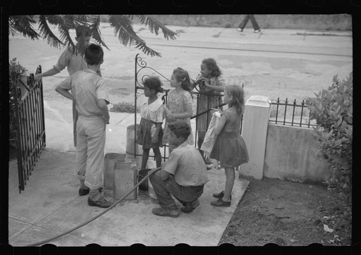 Untitled photo, possibly related to: San Juan, Puerto Rico. People carrying water home because of the failure of the water system in San Juan for three days