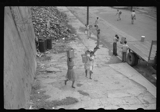 San Juan, Puerto Rico. People carrying water home because of the failure of the water system in San Juan for three days