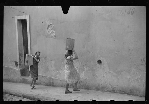 San Juan, Puerto Rico. People carrying water home because of the failure of the water system in San Juan for three days