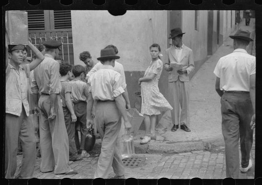 San Juan, Puerto Rico. People carrying water home because of the failure of the water system in San Juan for three days