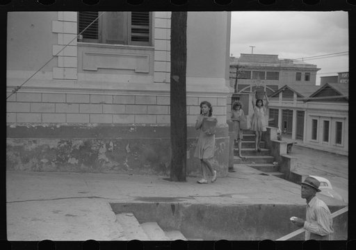 Untitled photo, possibly related to: San Juan, Puerto Rico. People carrying water home because of the failure of the water system in San Juan for three days