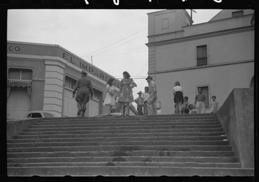 Untitled photo, possibly related to: San Juan, Puerto Rico. People carrying water home because of the failure of the water system in San Juan for three days