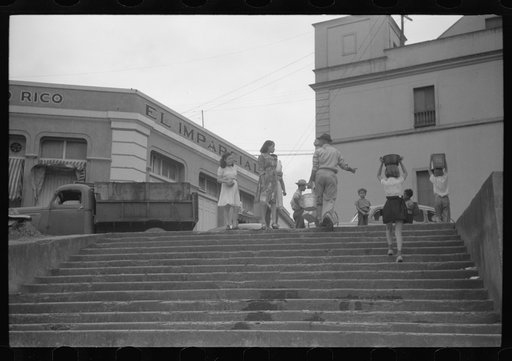 San Juan, Puerto Rico. People carrying water home because of the failure of the water system for three days