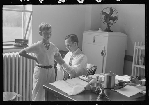 Untitled photo, possibly related to: Doctor examining child at preschool clinic. Greenbelt, Maryland