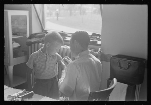 Untitled photo, possibly related to: Doctor examining child at Greenbelt in preschool clinic, Maryland