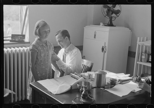 Doctor examining child at Greenbelt in preschool clinic, Maryland