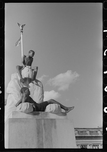 Colored boys playing on Columbus Monument. Washington, D.C.