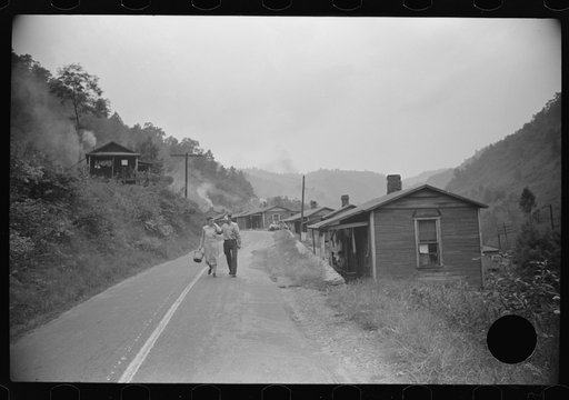 Untitled photo, possibly related to: Carrying water to one of the houses in abandoned mining community, Marine, West Virginia