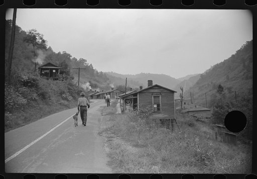 Untitled photo, possibly related to: Carrying water to one of the houses in abandoned mining community, Marine, West Virginia