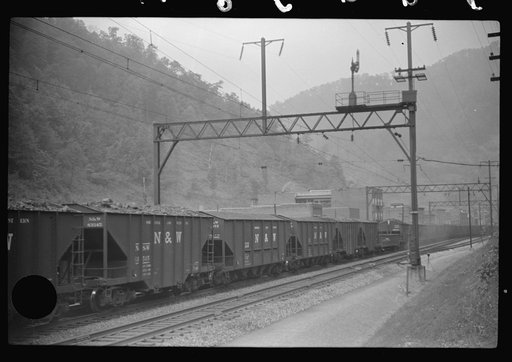 Untitled photo, possibly related to: Coal train going through center of mining town. Davey, West Virginia